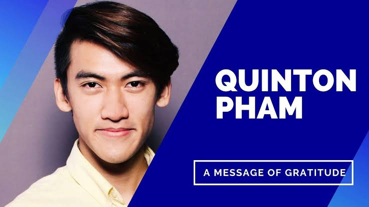 Dr. Quinton Pham in a yellow shirt